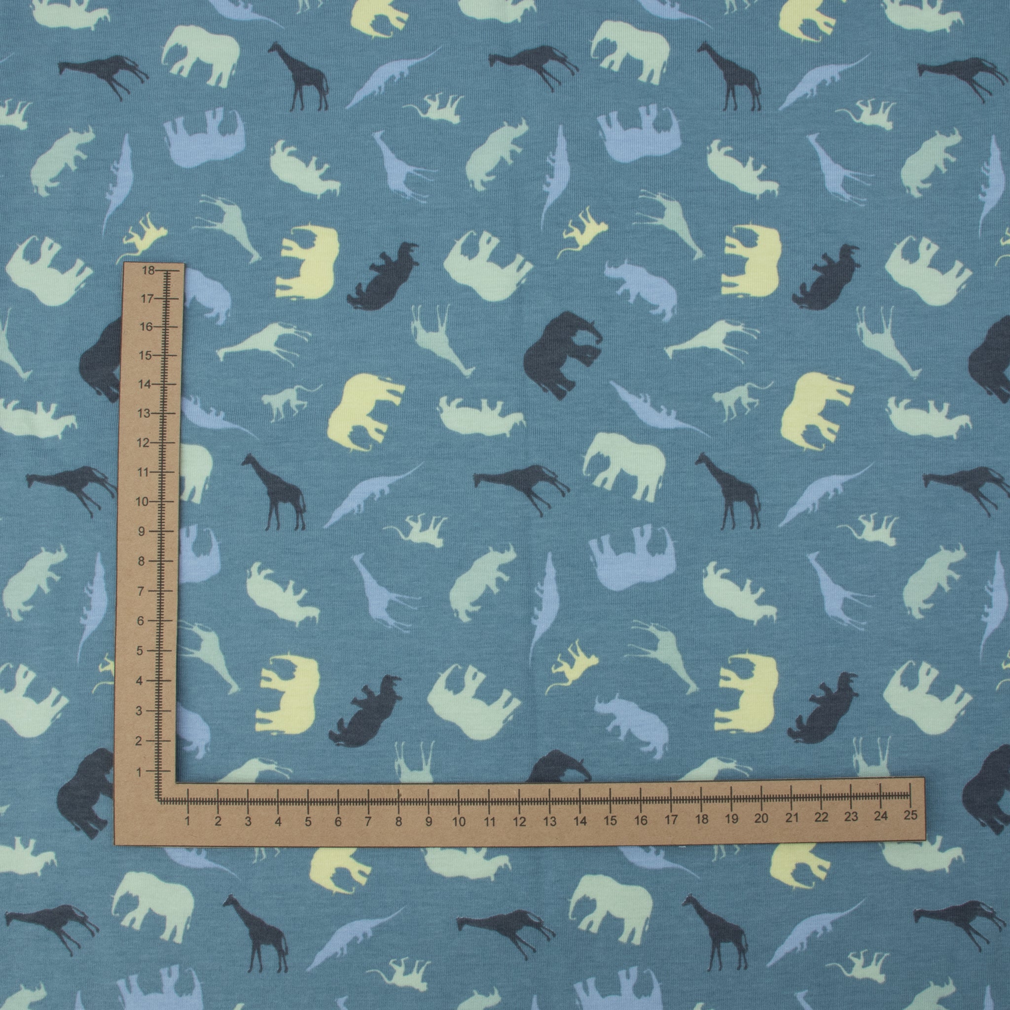 Jersey Safari Blau – Jerseystoff mit Tier-Silhouetten auf blauem Hintergrund