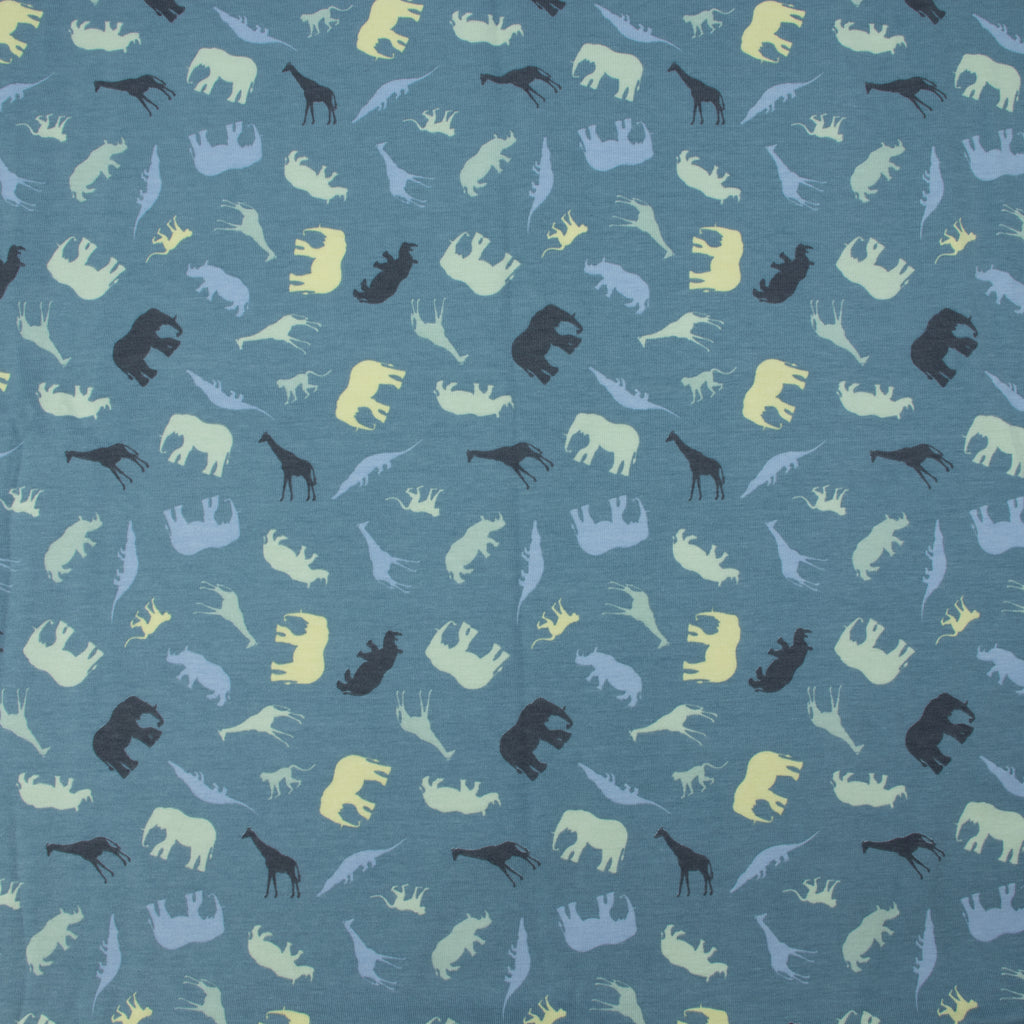 Jersey Safari Blau – Jerseystoff mit Tier-Silhouetten auf blauem Hintergrund
