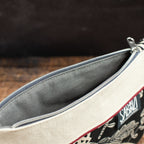 Flache kleine Reißverschlusstasche aus Canvas – schwarz/natur