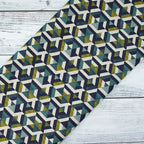 Dekostoff Retro-Grafik in Petrol, Senfgelb & Navy – 70 % Polyester / 30 % Baumwolle, ca. 140 cm breit