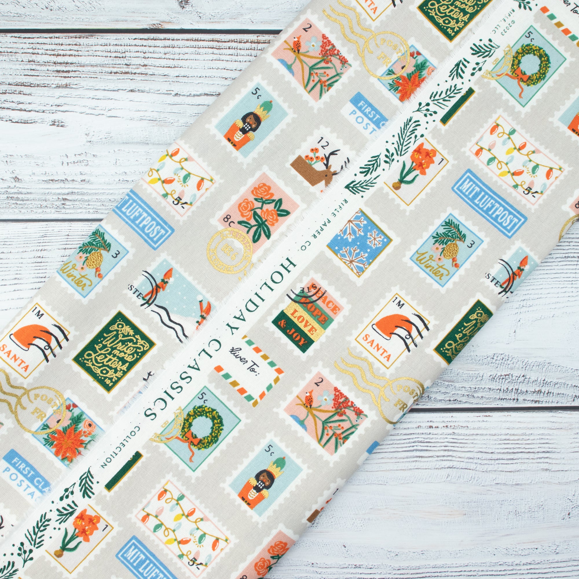 Cotton and Steel - Holiday Classics II - Holiday Stamps	Cream Canvas Metallic Fabric - Rifle Paper Co