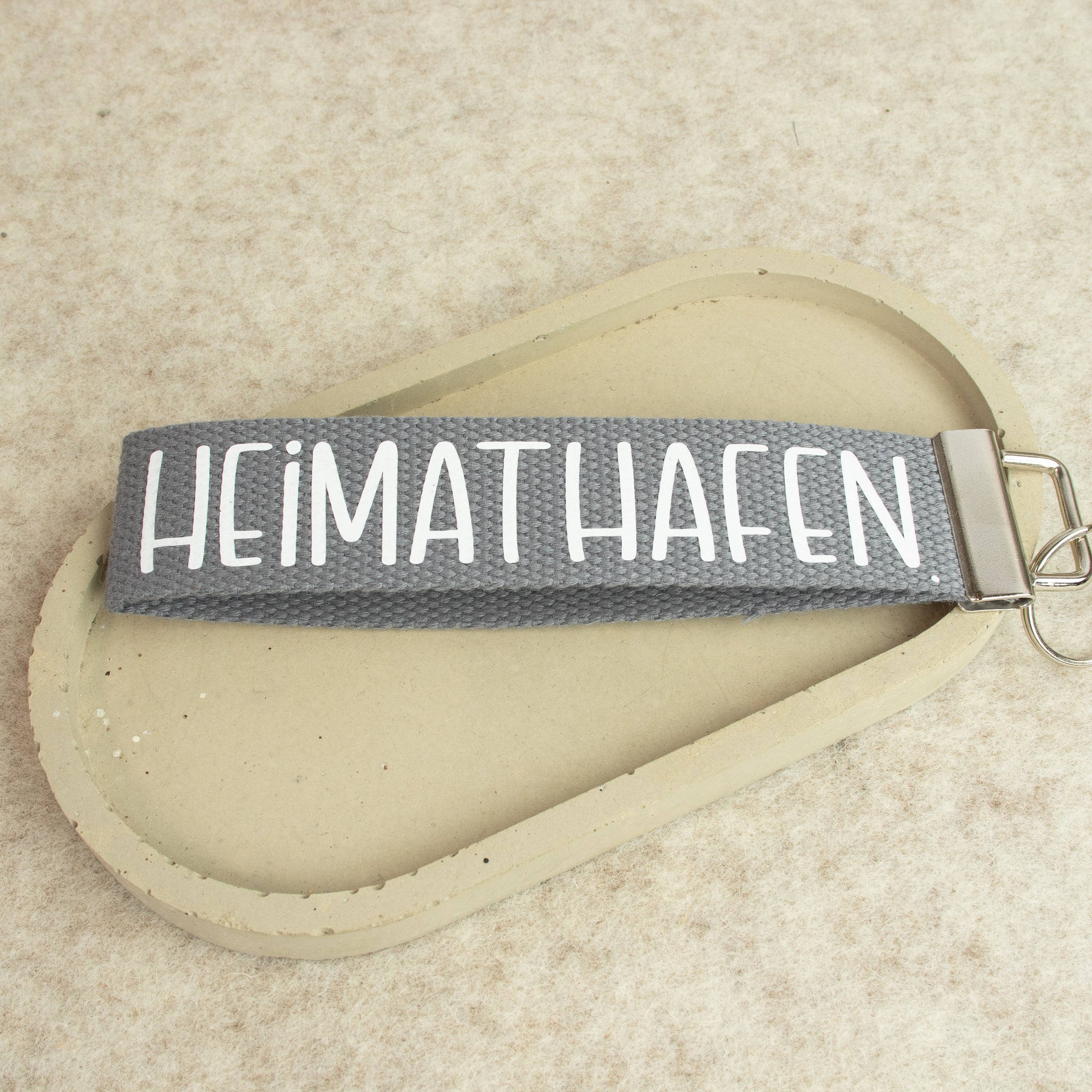 Schlüsselanhänger „HEIMATHAFEN“ – Schrift weiss