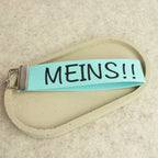 Schlüsselanhänger „MEINS!!“ – lustiger Schlüsselanhänger aus Baumwollband