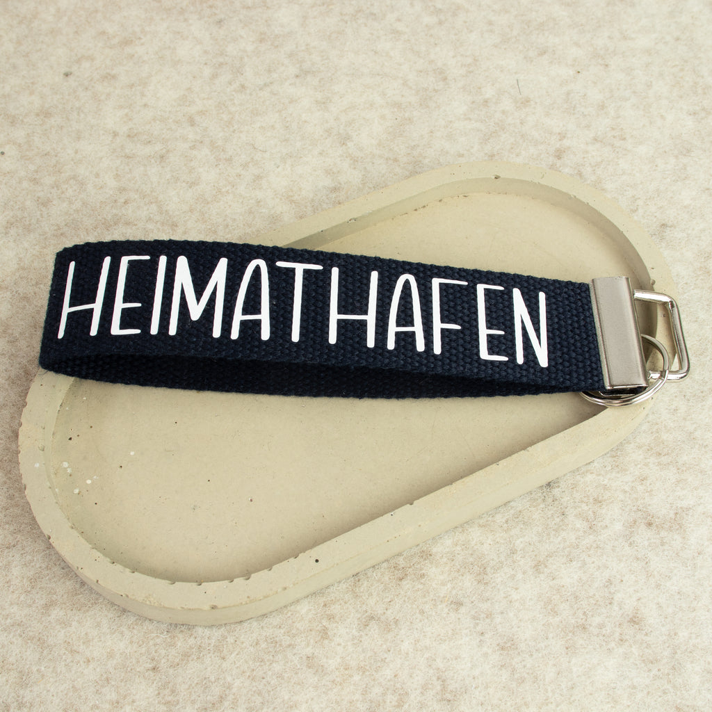 Schlüsselanhänger „HEIMATHAFEN“ – Schrift weiss